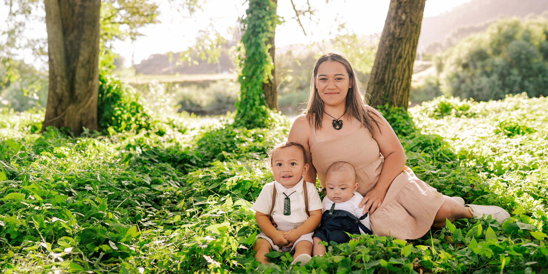 Family under a tree in New Zealand