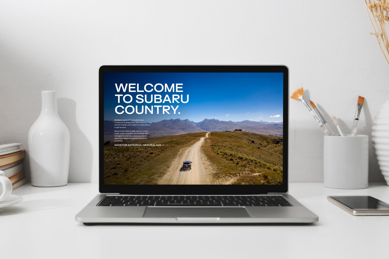 subaru.co.nz homepage on a laptop on a desk