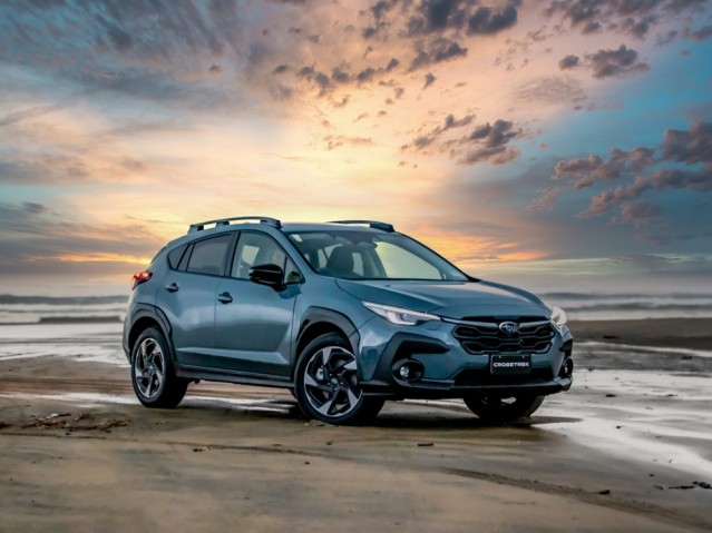 Subaru Crosstrek at sunset on the beach