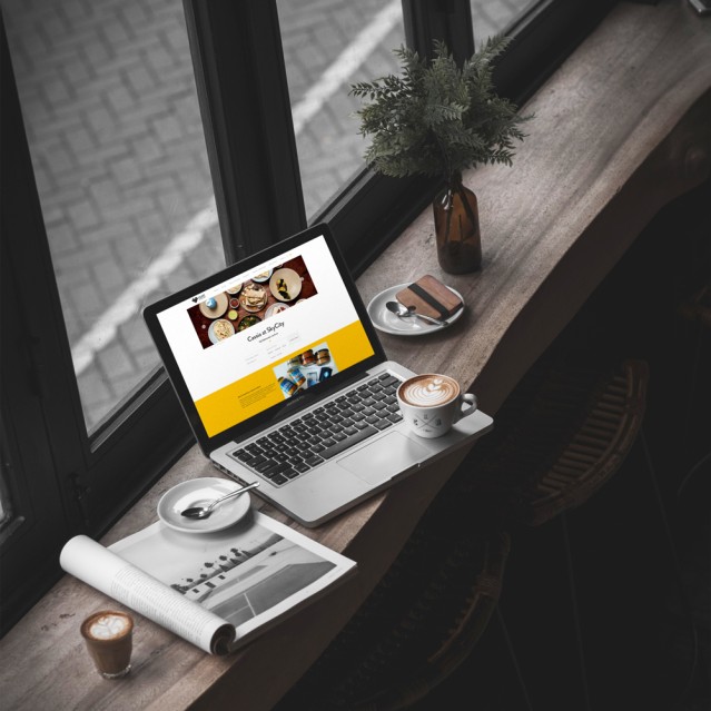Heart of the City website on a laptop in a cafe